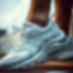 Close-up of Asics white sports shoes showcasing intricate design details.