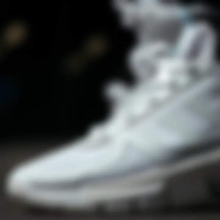 Close-up of Adidas white sports shoes showcasing unique design elements