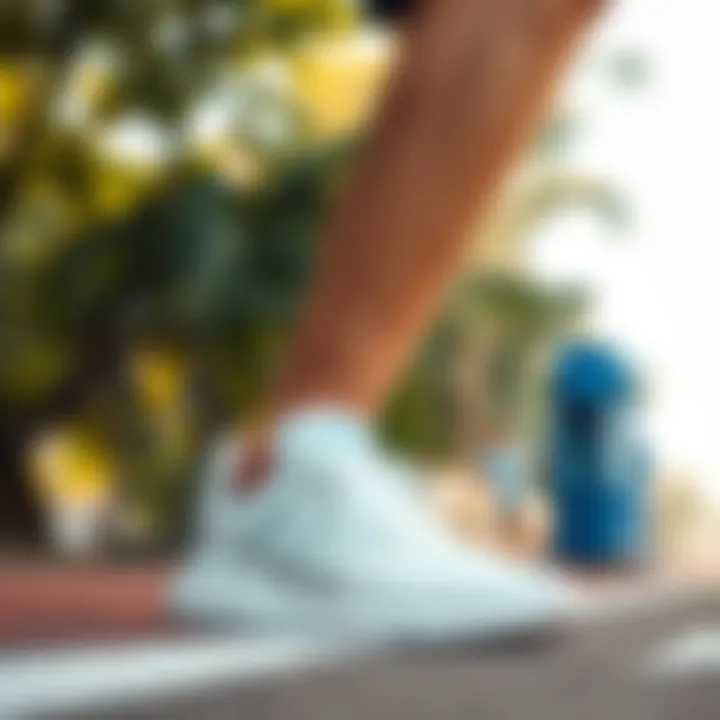 Adidas white sports shoes in a dynamic outdoor setting