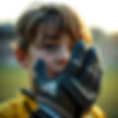 Close-up of a child wearing Adidas goalkeeper gloves