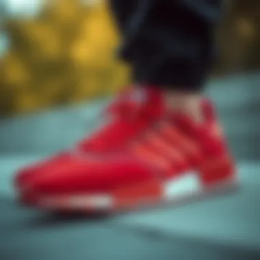 Close-up of red Adidas shoes highlighting intricate design details