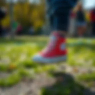 Red Converse shoes on a child’s feet during an outdoor activity