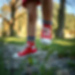 A child wearing red Converse shoes in a park