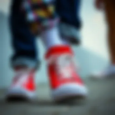 Close-up of red Converse shoes with colorful clothing
