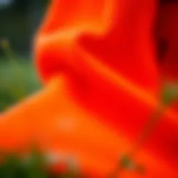 Vibrant orange tech fleece fabric showcasing its texture and quality